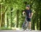 Cyclist admiring nature in green park