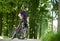 Cyclist admiring nature in green park