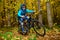 Cyclist in autumn forest