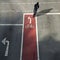 Cyclist from behind on a bike lane with symbol and arrow driving