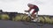 Cyclist biking in Triathlon - male triathlete cycling on triathlon bike