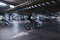 Cyclist on a blue bike rides on a speed under an underground car park