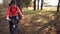 Cyclist. Caucasian sport woman rides along the track in the forest on a spring sunny day. Riding a sportsman girl on a
