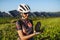 Cyclist charging her smartphone using a solar phone charger.