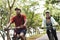 Cyclist couple riding together in a park