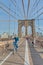 A cyclist crosses the Brooklyn Bridge in New York