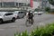 A cyclist crosses the HI Roundabout Bundaran HI with Welcome Monument Tugu Selamat Datang in the middle