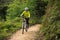 Cyclist cycling mountain bike on forest trail