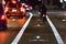 Cyclist drives on the bike path past the traffic jam