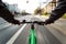 Cyclist drives on the bike path to a red traffic light - First-person view of cyclist