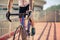 Cyclist feet pedaling a bicycle on bridge