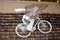 Cyclist flying over books.  Bookstore view inside. Bicicleta. LXfactory. Livraria.