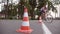 Cyclist go round traffic cones. Young handsome man riding a vintage bicycle. Sporty guy cycling at the park. Healthy