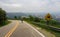 Cyclist going down the dangerous mountain road