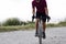 Cyclist grasping the handlebars of a road bike observing the city of Barcelona