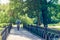 Cyclist in helmet riding in park on bridge