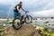 The cyclist with his bike looking at the horizon of the sea and