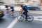 Cyclist in London city traffic in motion blur