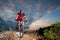 Cyclist on mountain bike races downhill in the nature