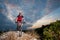 Cyclist on mountain bike races downhill in the nature