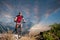 Cyclist on mountain bike races downhill in the nature