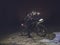 Cyclist on Mountain Bike on Snowy lake