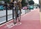 Cyclist passing over bicycle symbol in bike lane. Motion blur.