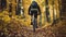 A cyclist pushes his bike through the hills in the autumn forest. 8K, close up, Back View