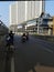 Cyclist resting by the railing next to the highway. Bekasi, Indonesia June 30 2020