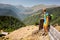 Cyclist rests in the mountains while biking