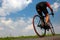 Cyclist rides on asphalt road