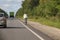 Cyclist rides on the highway on a bicycle