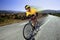 Cyclist riding a bike on an open road