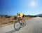 Cyclist riding a bike on an open road in Macedonia