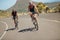 Cyclist riding bikes on open road