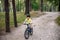 Cyclist Riding down the sandy Hill on the Offroad Trail