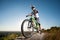 Cyclist riding downhill on mountain bike on the hill