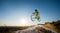 Cyclist riding downhill on mountain bike on the hill