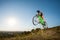 Cyclist riding downhill on mountain bike on the hill
