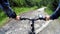 Cyclist riding mountain bike along dirt road with GPS in Bieszczady, Poland