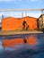 Cyclist on the road, reflection of a cyclist on the road in water