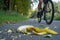 cyclist swerving to avoid a banana peel on a bike path