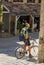 Cyclist takes a break in medieval village of Beynac et Cazenac,