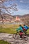 Cyclists against Weissenkirchen village in Wachau during spring time, Austria