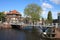 Cyclists on bridge over canal in Leiden, Netherlands