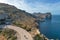 cyclists and camper van on the curvy mountain road leading to Cap de Formentor in northern Mallorca