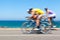 Cyclists competition along a coastal road