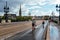 Cyclists crossing Pont de Pierre Bridge in Bordeaux