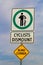 A cyclists dismount sign with a blind corner warning