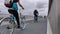 Cyclists drive over the bridge at summer cloudy day,